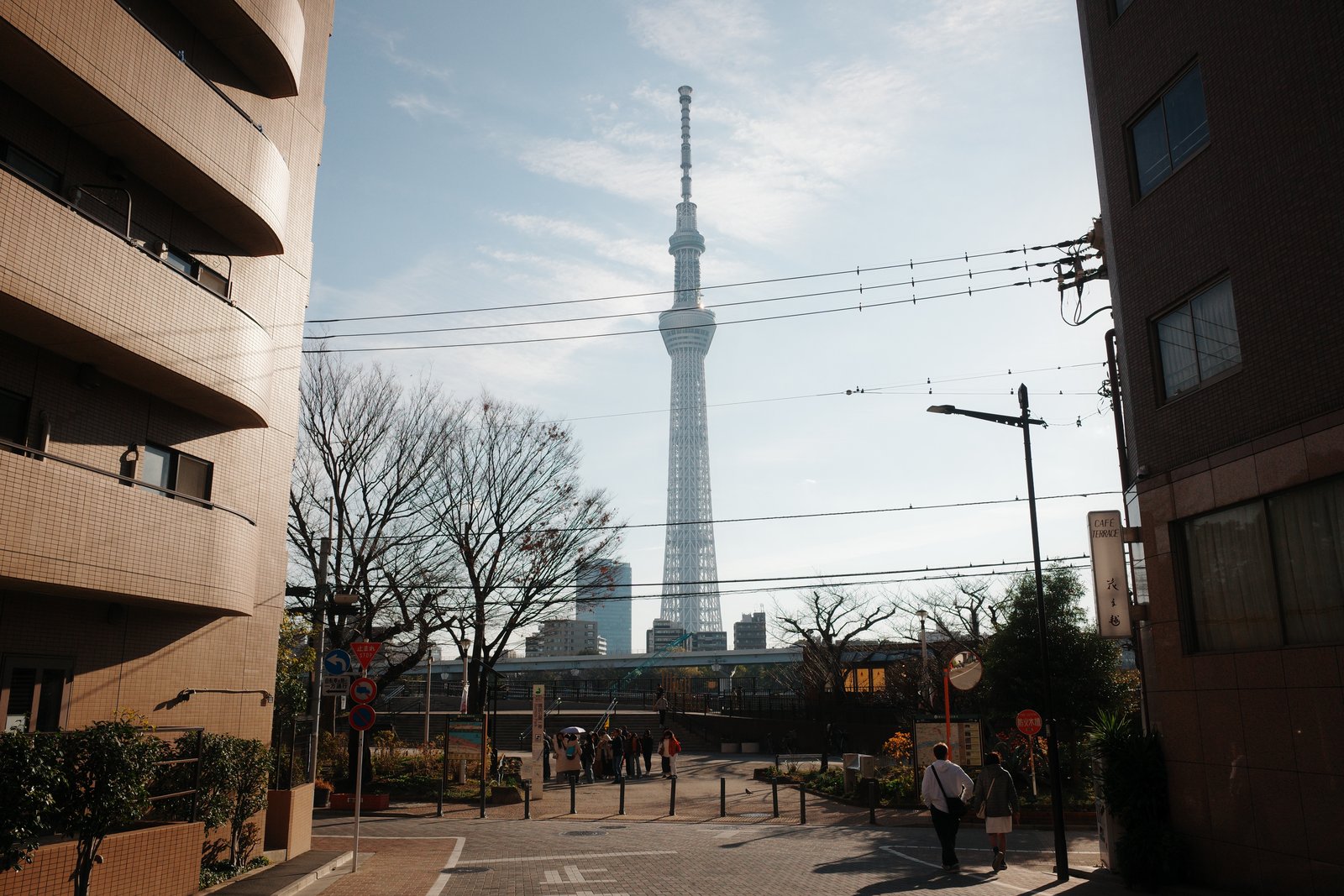 tokyo skytree seen between buildings