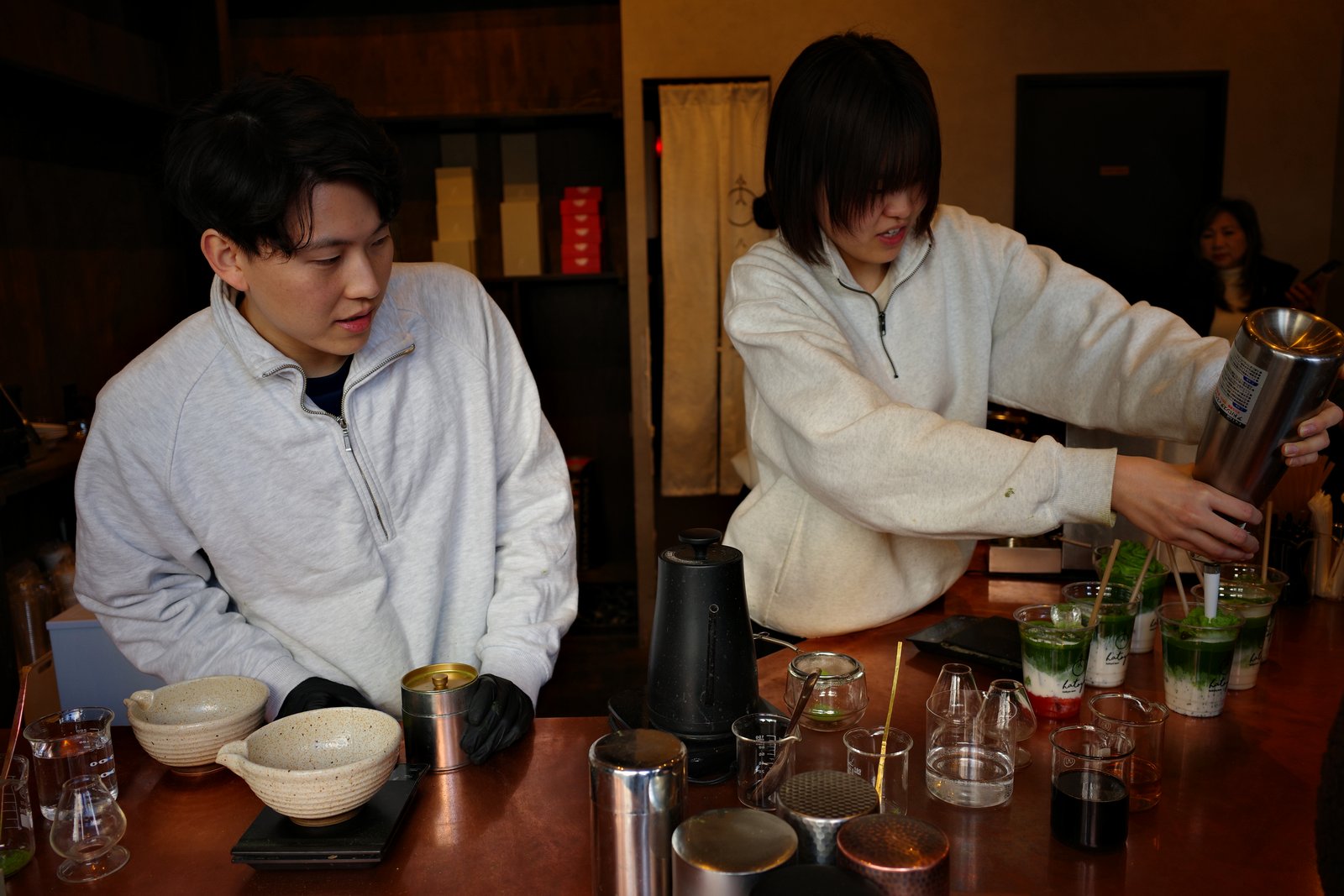 barista preparing matcha at a counter