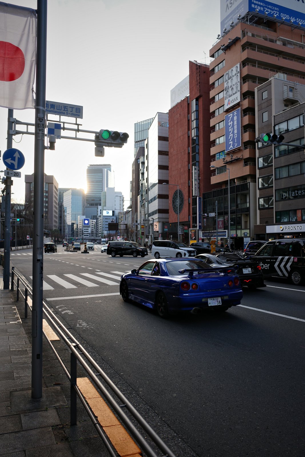 blue nissan skyline gt-r on a tokyo street