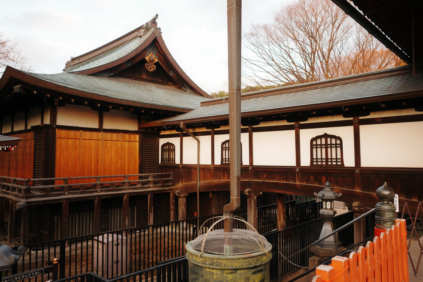 wooden shrine hall with a bronze basin